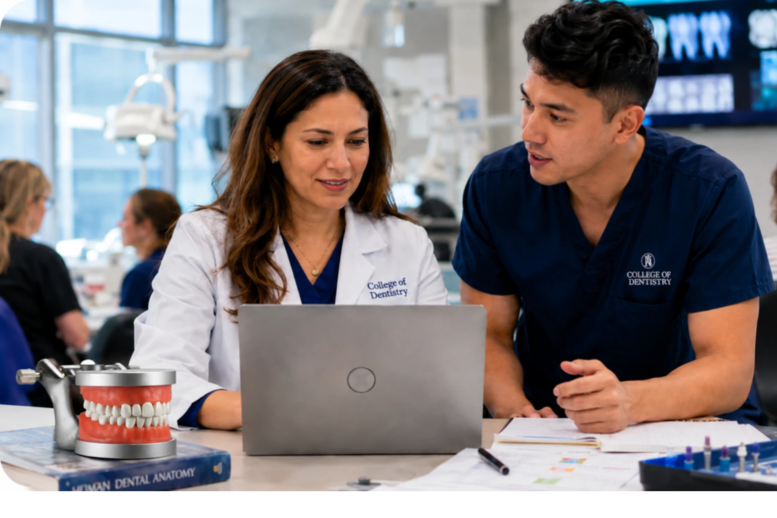 Faculty reviewing student progress